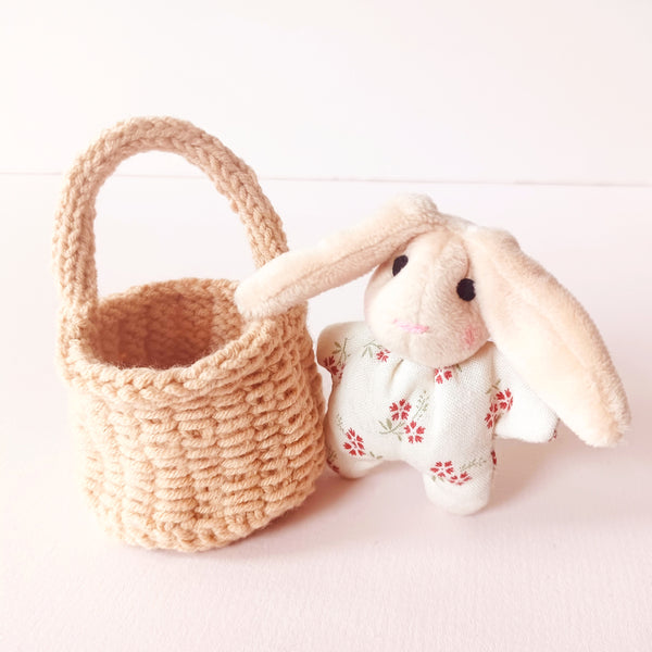 Tiny Bunny in a knitted basket